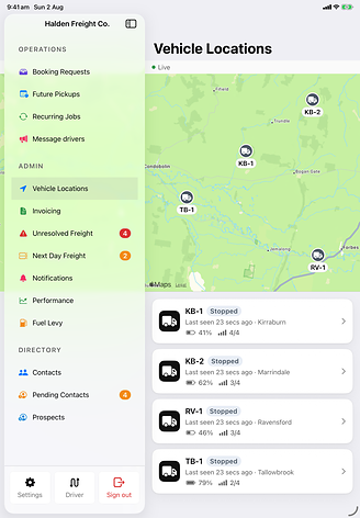 The Nado admin sidebar open beside a live vehicle map, four vehicles pinned across the region with last-seen times, battery and signal for each.